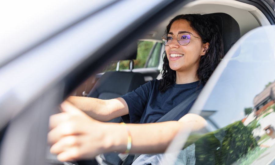 Woman focused on road while driving