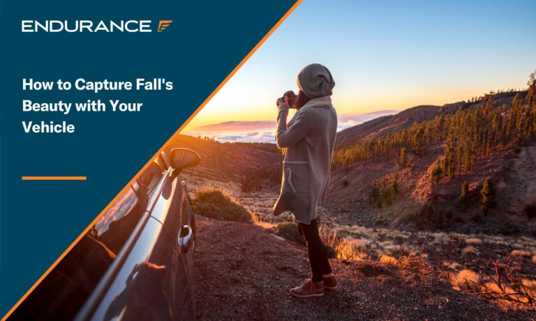 Woman photographing beautiful landscape above the clouds near the car