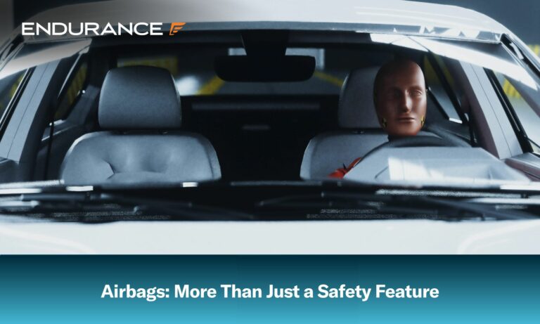 Car crash test dummy sitting in car with airbags