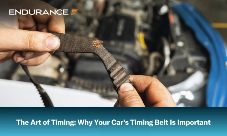 An auto mechanic shows a torn timing belt