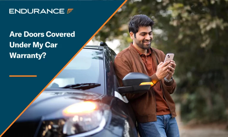 Smiling young man texting on mobile phone leaning on car