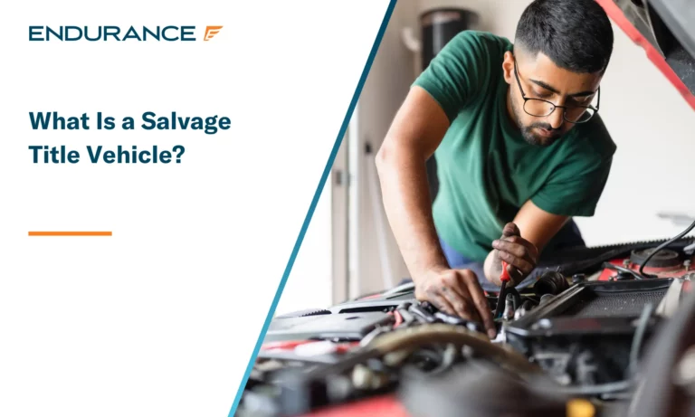 Young man fixing his car engine at home