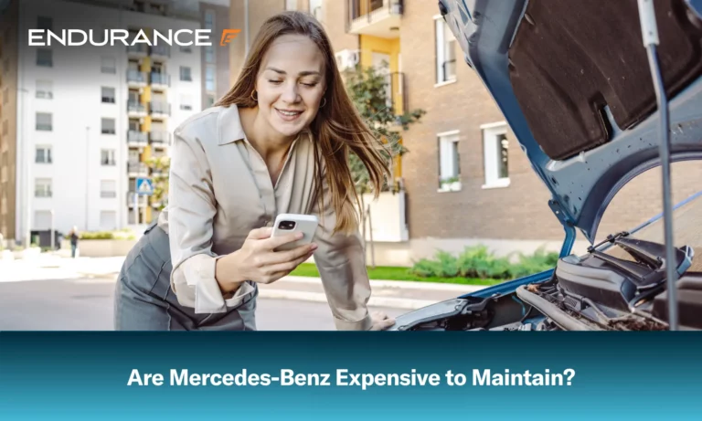Woman checking the engine on car and looking at her cell phone