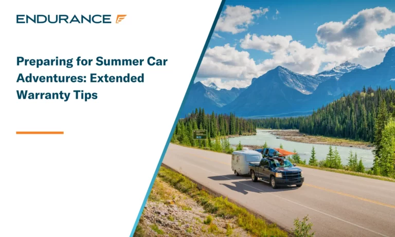 Pick-up truck with travel trailer and kayaks drives on a mountain road