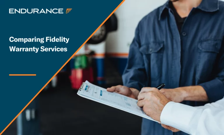 Mechanic signing a document from a customer in a garage