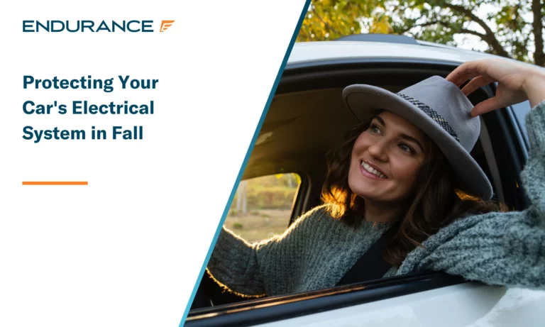 Woman driver with a hat, fall leaves and sunshine in the window