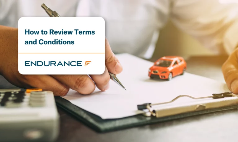 Business person with a vehicle service contract about to sign
