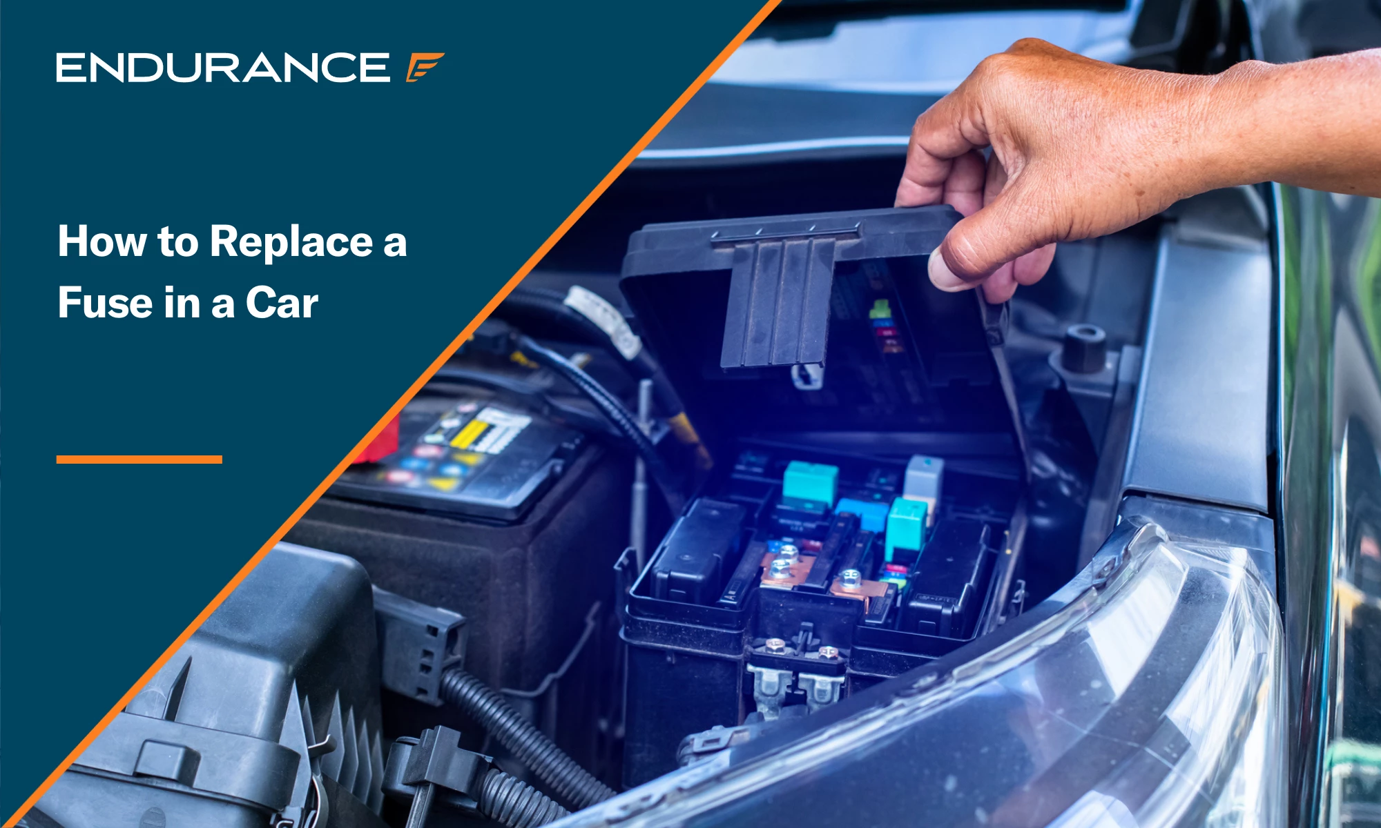 A mechanic opening the cover of a car's electrical system control or fuse box