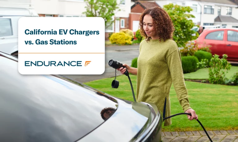 A woman using an electric car charger at home