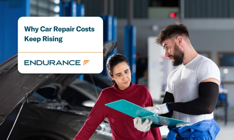 A professional mechanic briefs a customer about the cost of car repairs