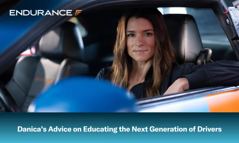 Danica Patrick in a car looking out the drivers side window