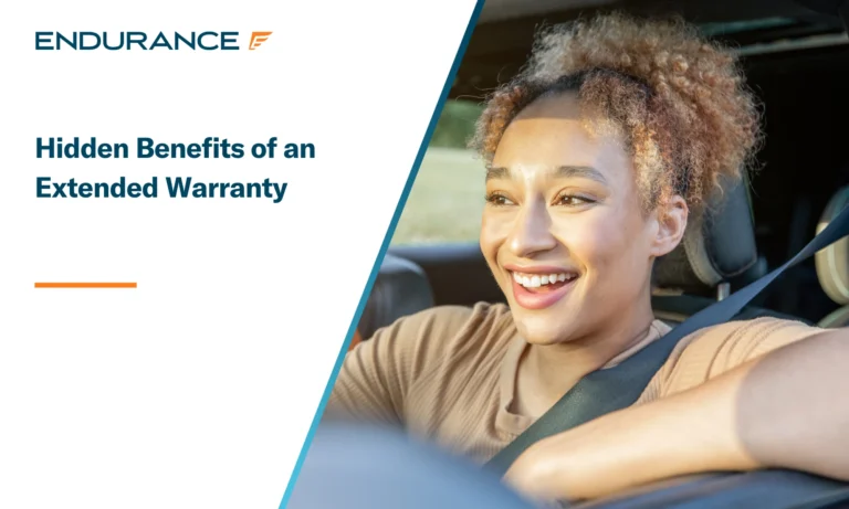 Young woman smiling while driving her car