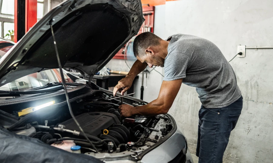 Mechanic doing repairs on a car at the auto repair shop