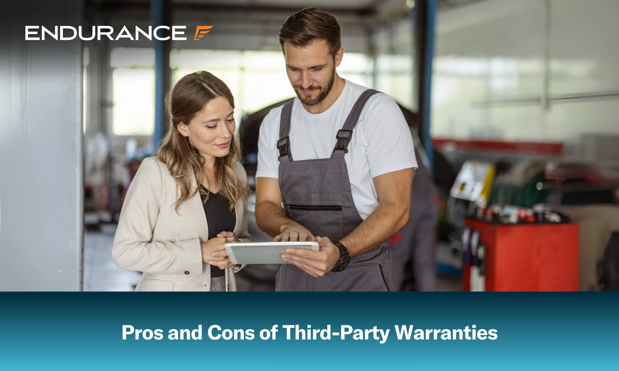 A mechanic and a businesswoman looking at a digital tablet at a service garage