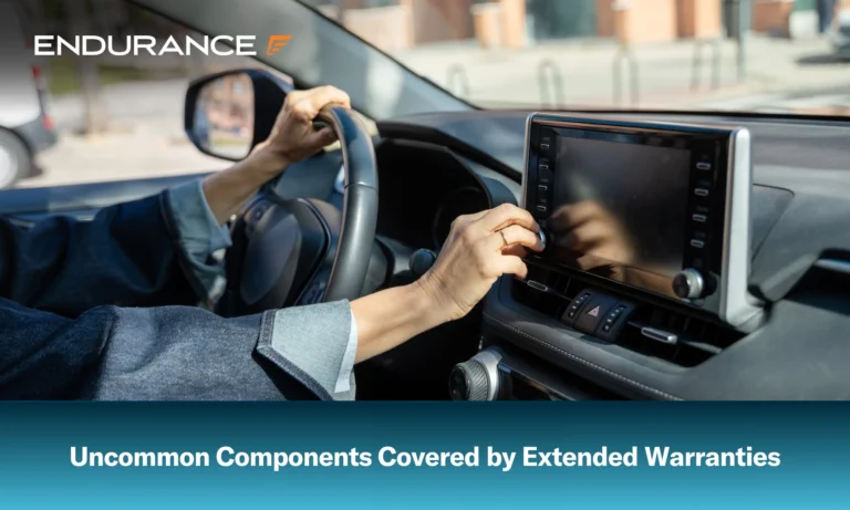 Woman driving a car and adjusting her infotainment system