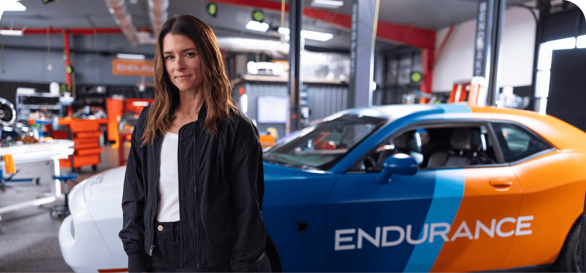 Danica Patrick in front of Endurance car
