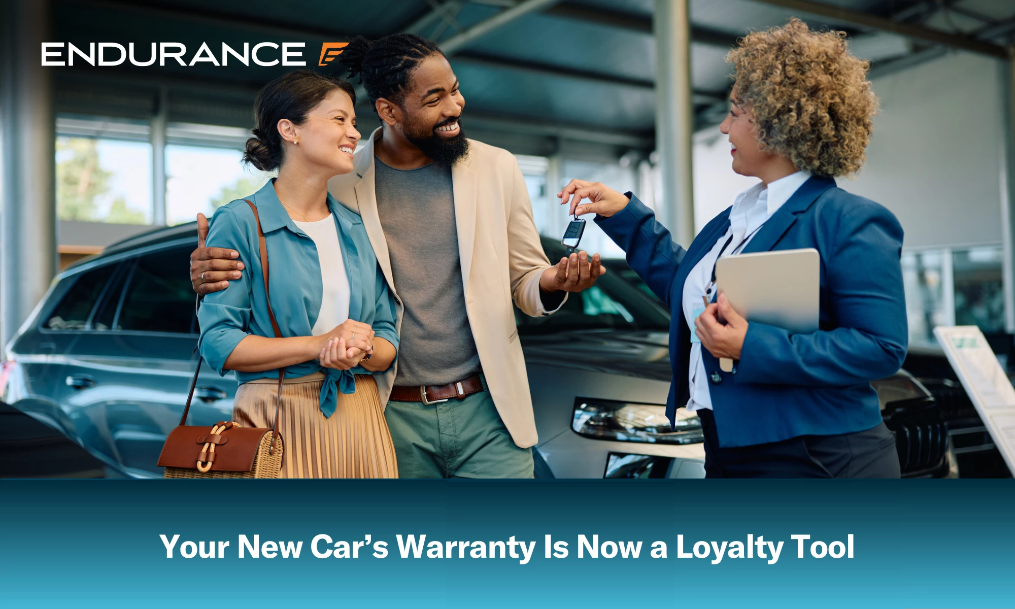 Happy couple receiving keys of their new car from saleswoman