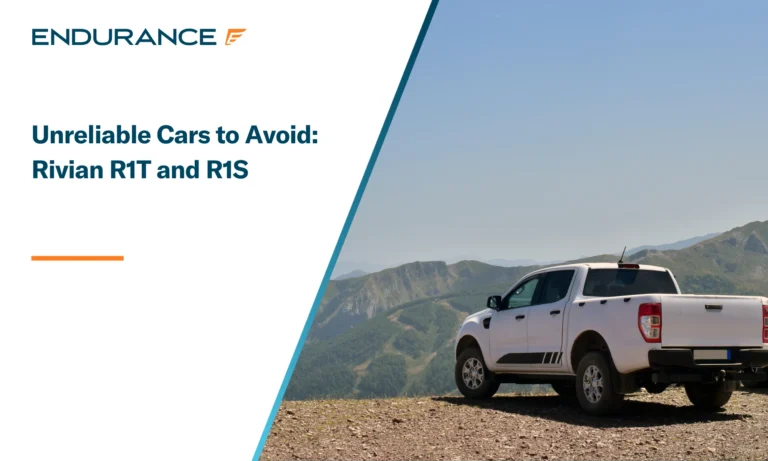 A white Rivian R1T truck parked in the mountains
