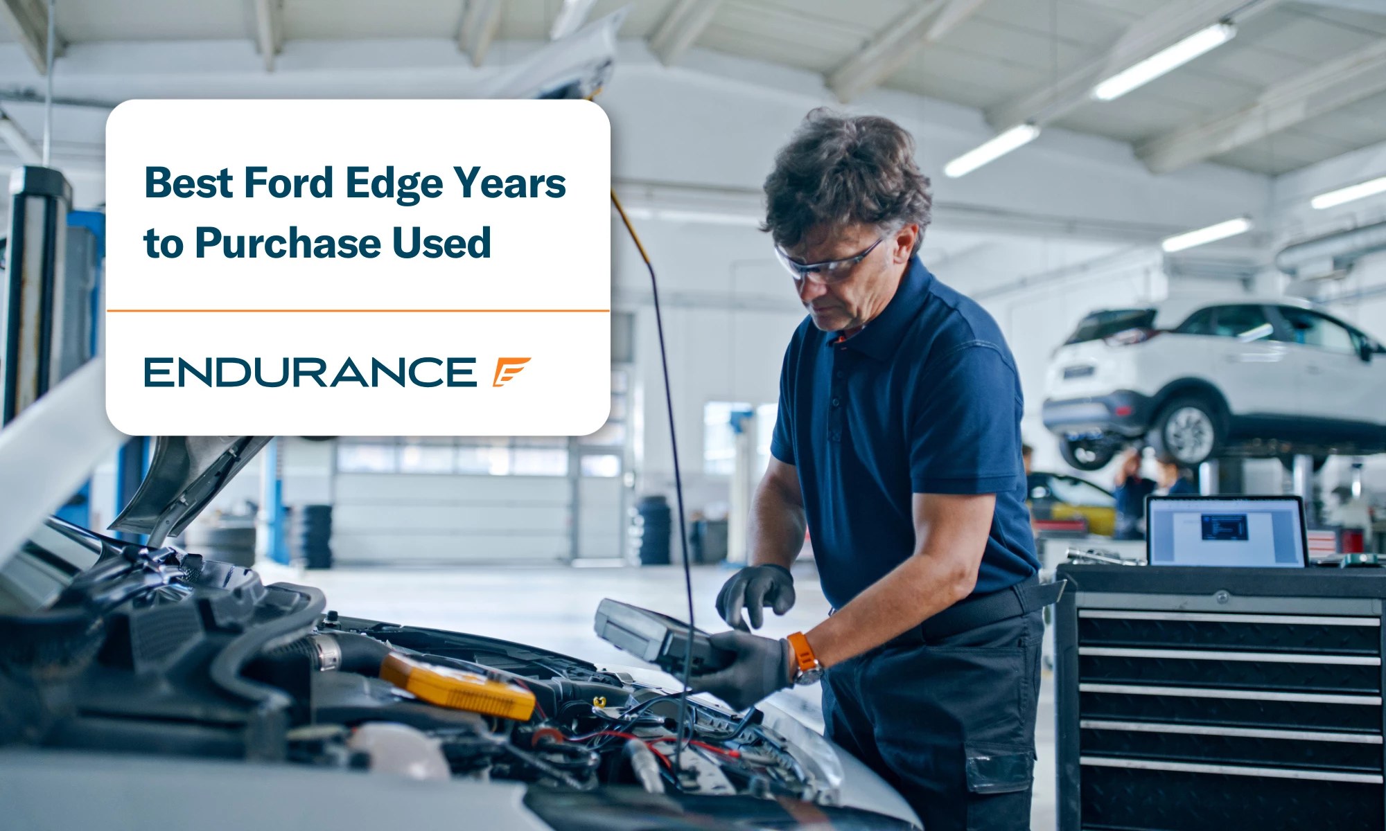 A male mechanic with the hood of a Ford Edge open