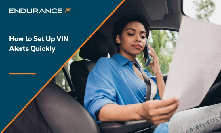 Young woman sitting in her car while on a phone call, focusing on paperwork