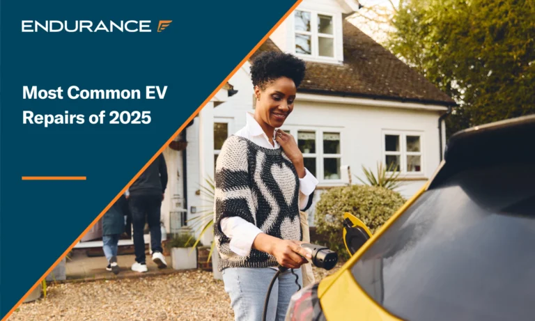 Woman plugging in electric charger into her car outside of a home