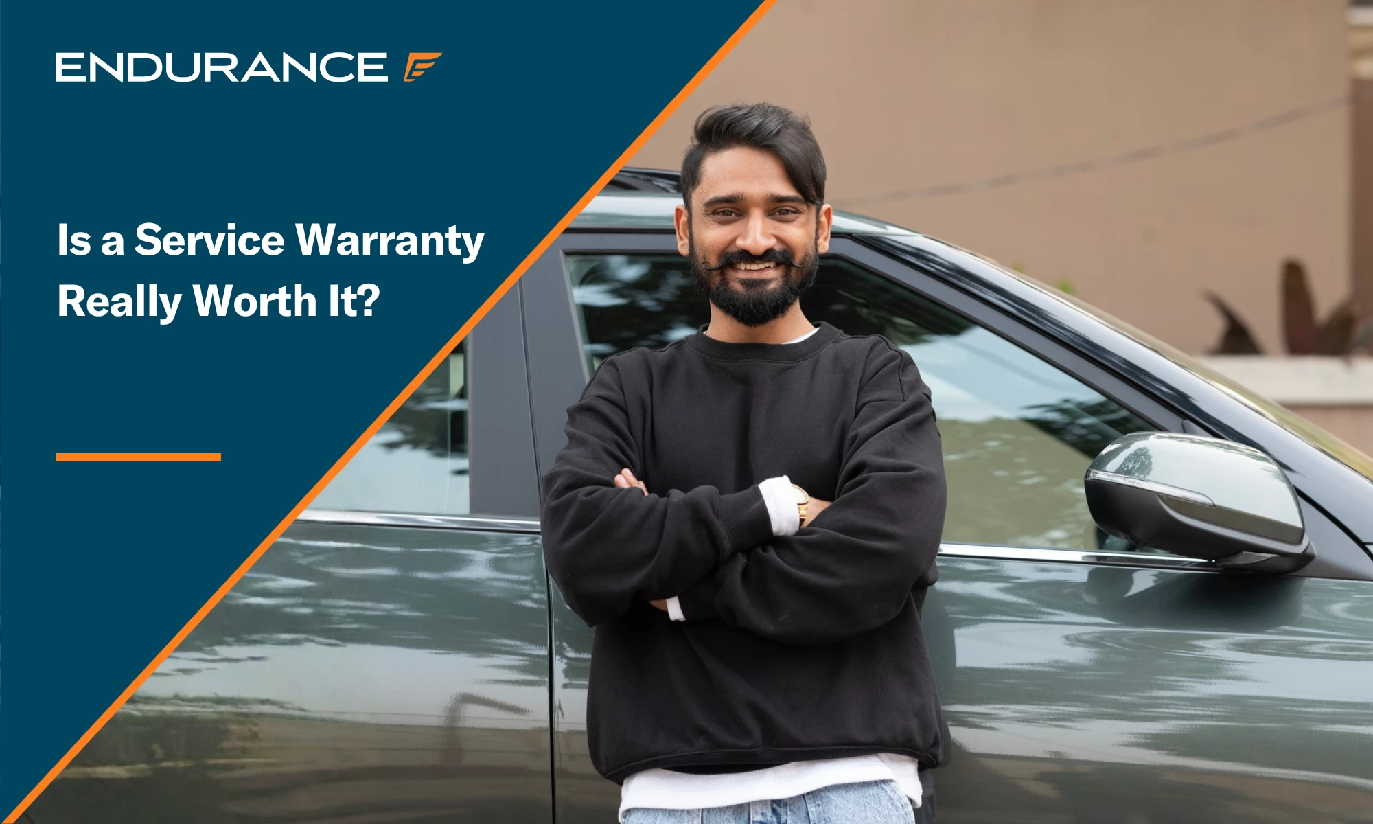 A man with his arms crossed leaning on a vehicle