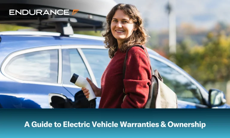 A woman with a backpack standing next to a charging electric car