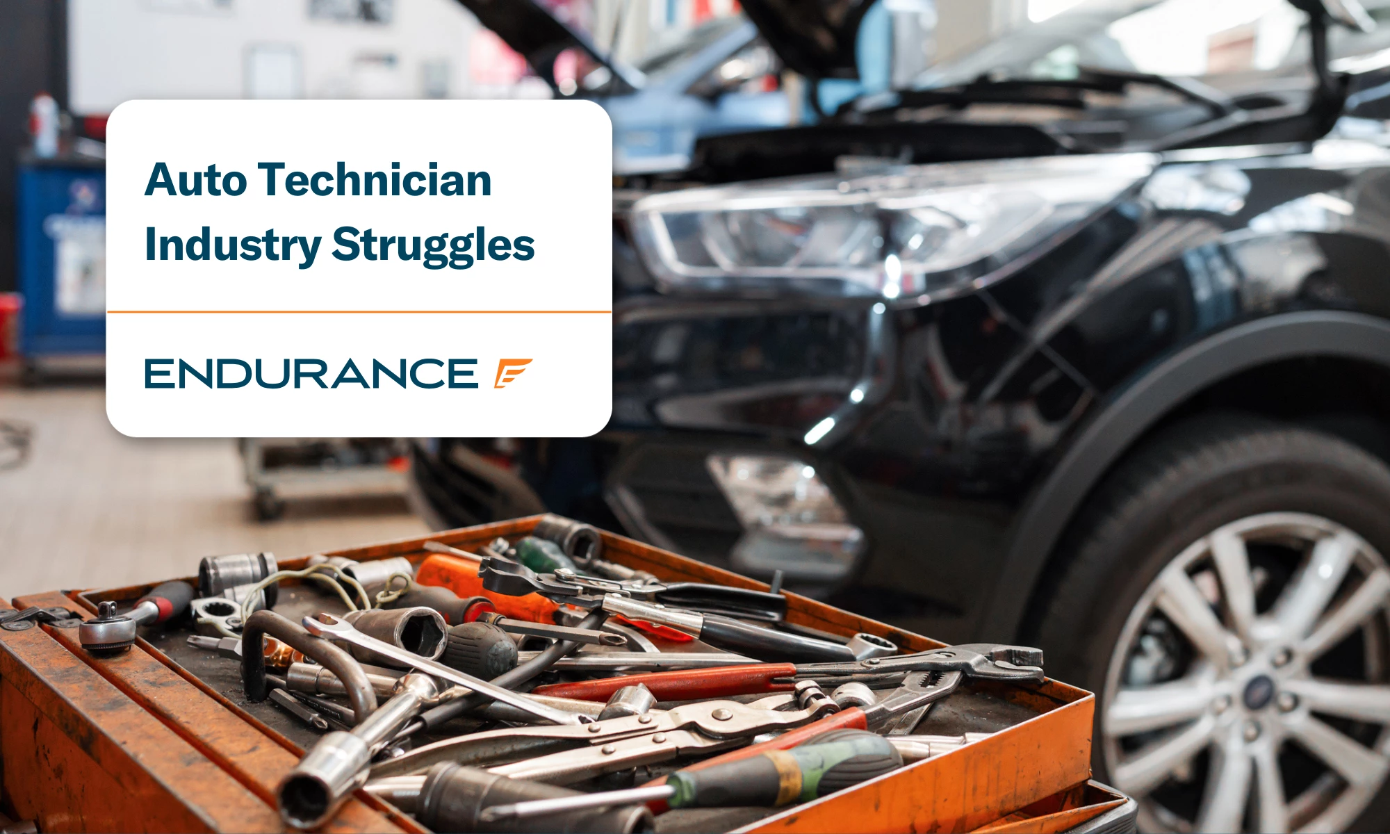 A vehicle repair shop with tools on a cart