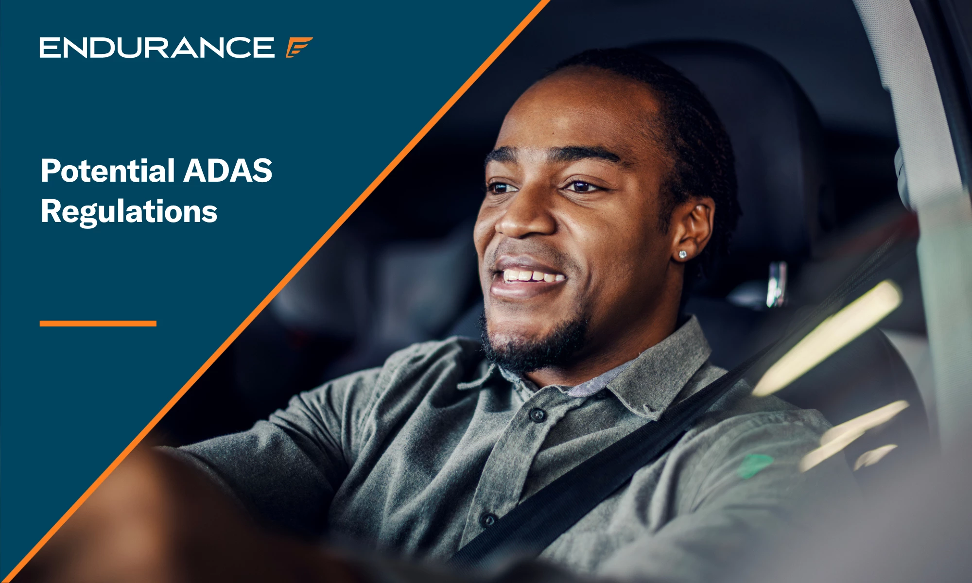 Young adult man smiling driving car