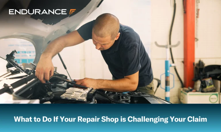 Auto mechanic inspects car engine under the hood