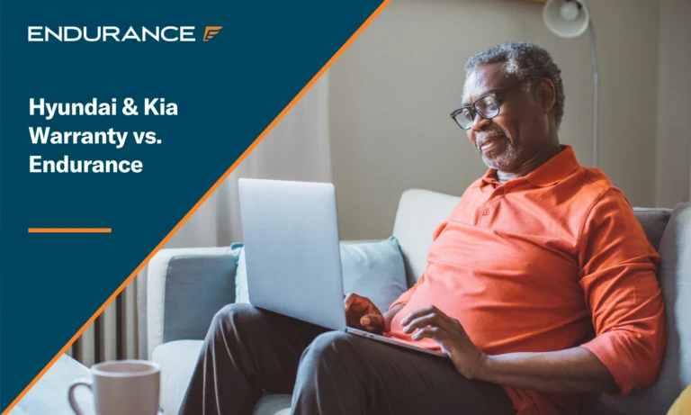 Older man at home, sitting on sofa and using laptop to compare coverage