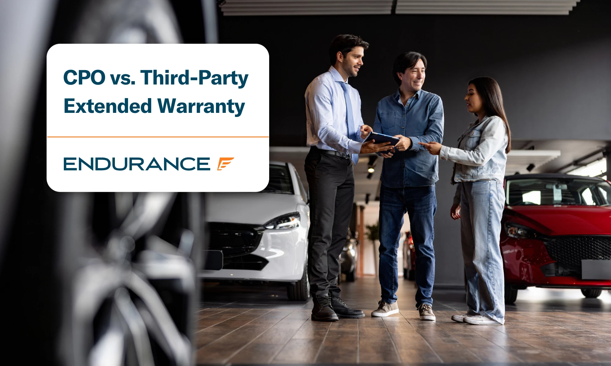 Father and daughter talking to a car salesman at the dealership