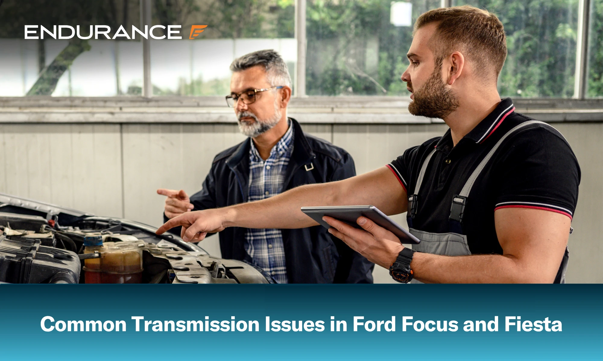Auto mechanic with a customer, common Ford Fiesta and Focus transmission issues