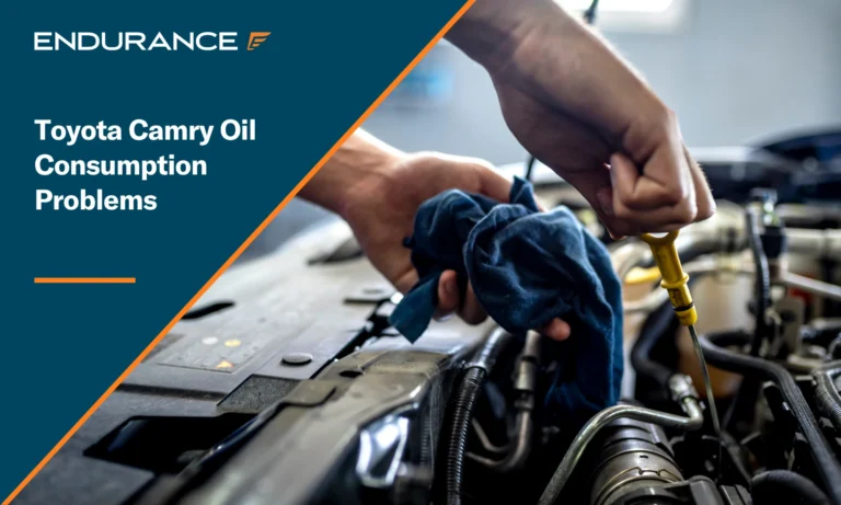 Mechanic checking the oil level in a car, Toyota Camry oil consumption problems