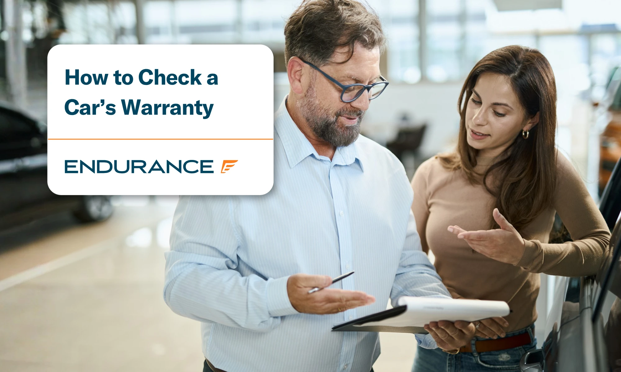 Woman with car salesperson in a showroom, how to check if your car is still under warranty